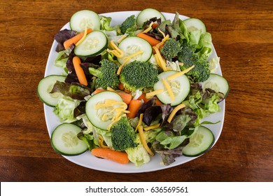 Healthy Salad Of Greens, Cucumbers, Carrots And Brocolli