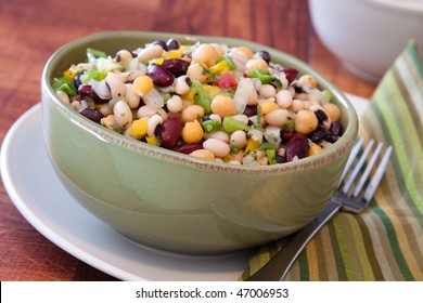 Healthy Salad Made With Red Kidney Beans, Black Eyed Peas, Corn, Spring Onions, Chickpeas, Celery, And Seasoning.