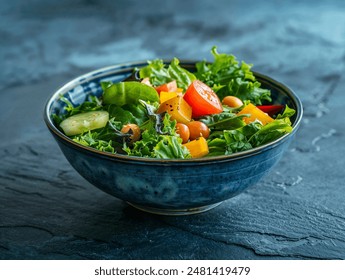 Healthy salad in modrn ceramic bowl on dark slate table - Powered by Shutterstock