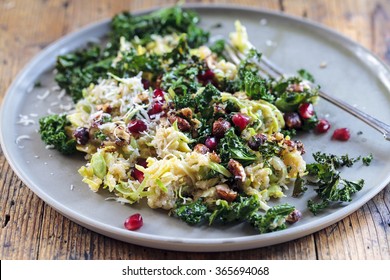 Healthy Salad With Quinoa, Brussel Sprouts, Crispy Kale, Hazelnuts And Pomegranate