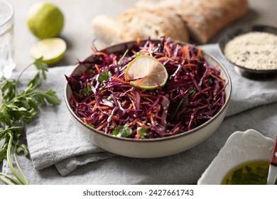 Healthy salad of red cabbage, carrots, coriander and sesame.  Healthy eating, vegan food concept.