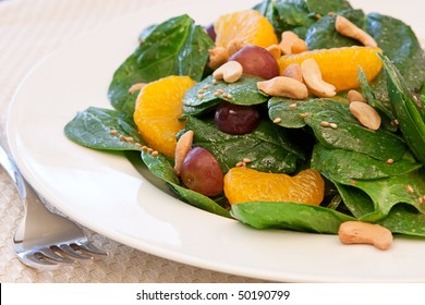 A Healthy Salad Of Spinach,Mandarin Oranges, Cashews And Grapes