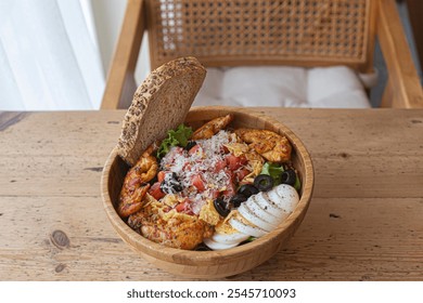 Healthy salad wood bowl with various vegetables, chicken. - Powered by Shutterstock