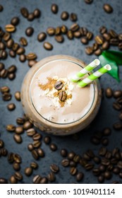 Healthy Salted Caramel Mocha Coffee Smoothie And Coffee Beans On Dark Concrete Background. Top View, Space For Text, Close Up, Selective Focus.