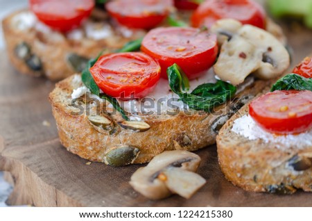 Healthy sandwich with Wholemeal Bread Toast and  with Cream cheese ,green spinach,olive oil mushrooms  and tomatoes,