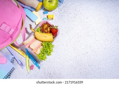 Healthy School Lunch Box: Sandwich, Vegetables, Fruit, Nuts And Yogurt With School Kids Supplies, Accessories And Backpack On Black Background Flatlay Copy Space. Back To School Concept