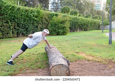 Healthy Senior Man Doing Push Ups On Outdoors