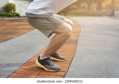 A Healthy Senior Man With Legs Muscles Warming Up Before Workout In The Park, Concept Elderly People Warm Up Exercise Prevent Injury