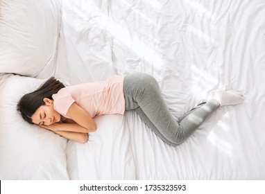 Healthy Sleep. Chinese Woman Sleeping Well Lying In Bed At Home. View From Above