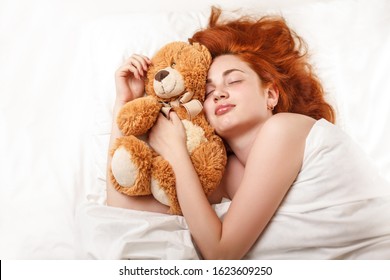 Healthy Sleep. A Woman Is Sleeping In The Bed. Girl In The Bedroom At Night. Proper Sleep Patterns And Hormone Melotonin