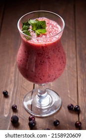 Healthy smoothie from fruits with yogurt. Blended berry of blackcurrant vitamin drink.