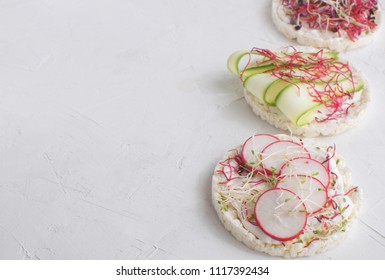 Healthy snack concept Rice bread Crispy bred Radish slices Sprouts Marrow slices Cottage cheese High key Top view Copy space 