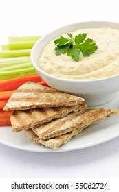 Healthy Snack Of Hummus Dip With Pita Bread Slices And Vegetables