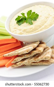 Healthy Snack Of Hummus Dip With Pita Bread Slices And Vegetables