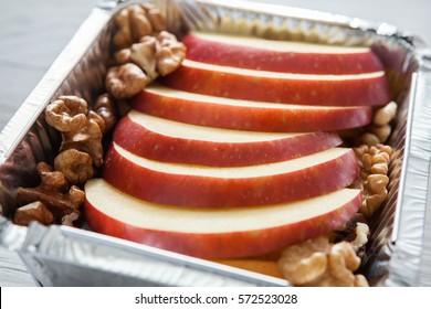 Healthy Snack Or Lunch. Natural Food In Foil Box, Diet Concept. Apple Dessert With Walnuts