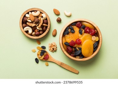 healthy snack: mixed nuts and dried fruits in bowl on table background, almond, pineapple, cranberry, cherry, apricot, cashew. - Powered by Shutterstock