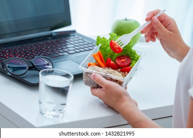 Healthy Snack At Office. Woman Eating Food From Take Away Lunch Box At Workplace During Lunch Break. Container Food At Work