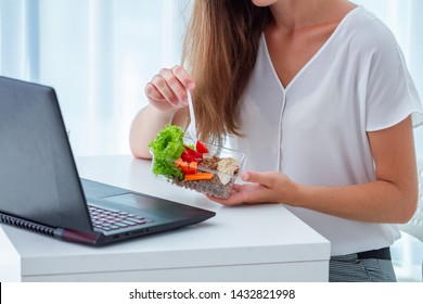 Healthy Snack At Office Workplace. Business Woman Eating Meals From Lunch Box At Working Table During Lunch Break. Food At Work