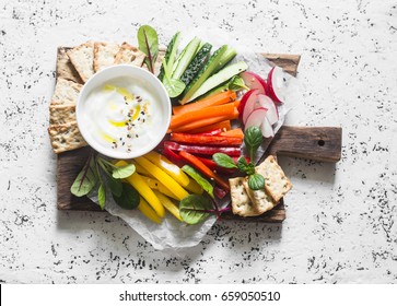 Healthy Snack - Raw Vegetables And Yogurt Sauce On A Wooden Cutting Board, On A Light Background, Top View. Vegetarian Healthy Food Concept