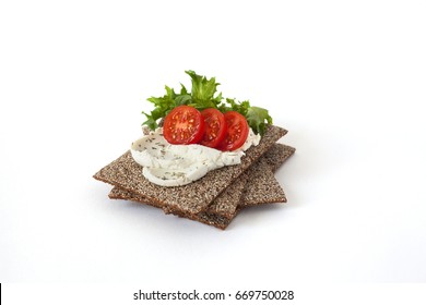 Healthy Snack From Wholegrain Rye Crispbreads Crackers With Cherry Tomatoes, Salad And Goat Cheese Isolated On White Background