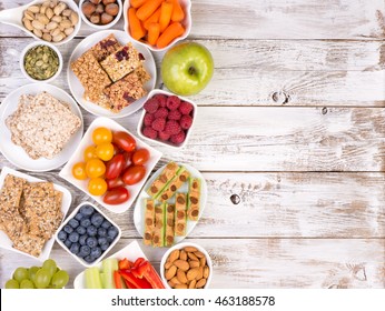 Healthy snacks on wooden table with copy space, top view - Powered by Shutterstock