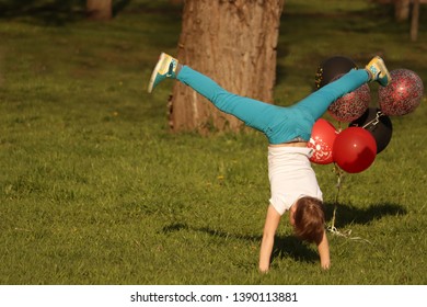 Healthy Sport Little Boy Tumbling On Green Lawn In Th Park