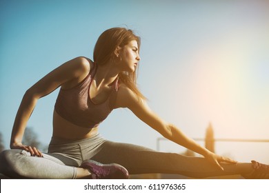 Healthy Sports Lifestyle. Athletic Young Woman In Sports Dress Doing Fitness Exercise. Fitness Woman On Stadium. 