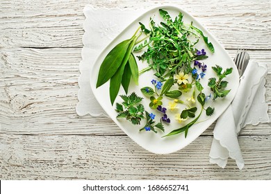 Healthy Spring Food Ingredients. Dandelion, Wild Garlic, Flowers And Nettle On Wooden Background