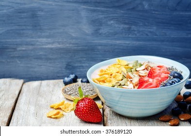 Healthy Strawberry Smoothie Bowl With Fruits, Cereals, Seeds And Nuts. Toning. Selective Focus