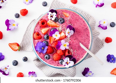 Healthy Summer Berry Smoothie Bowl With Flowers And Chia Seed