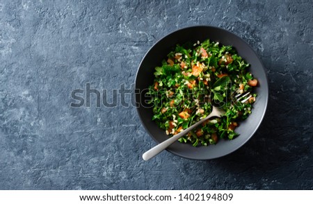 Healthy summer tabule salad bowl top view with copy space