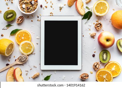 Healthy Super Food And Technology Background, Digital Tablet Computer Apps For Cooking Diet Nutrition Plan, Fresh Fruit Granola Seeds On White Organic Table, Health Care Detox, Top View Mockup Screen