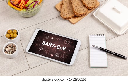 Healthy Tablet Pc compostion with SARS-CoV inscription, immune system boost concept - Shutterstock ID 1732900166