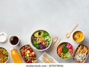 Healthy take away food and drinks in disposable eco friendly paper containers on gray background, top view. Fresh salad, soup, poke bowl, buddha bowl, fruits, coffee and juice. - Shutterstock ID 2070578456