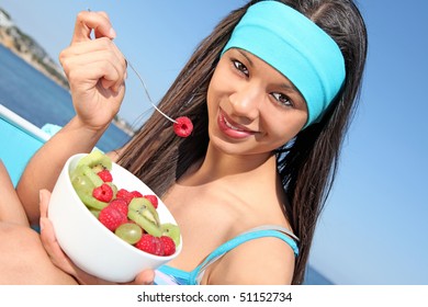 Healthy Teenager Eating Fresh Fruit Salad