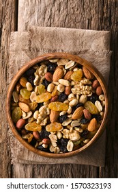 Healthy Trail Mix Snack Made Of Nuts (walnut, Almond, Peanut) And Dried Fruits (raisin, Sultana) In Wooden Bowl, Photographed Overhead (Selective Focus, Focus On The Trail Mix)