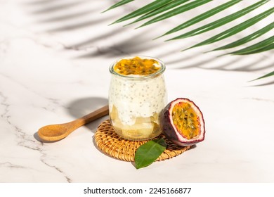Healthy tropical fruit chia pudding with passionfruit in a glass, Delicious breakfast or snack, Clean eating, dieting, vegan food concept. top view,