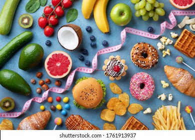 Healthy and unhealthy food background from fruits and vegetables vs fast food, sweets and pastry top view. Diet and detox against calorie and overweight lifestyle concept. - Shutterstock ID 1761913937