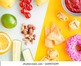 Healthy And Unhealthy Food, Dieting Concept. Fast Food On Yellow And Green Vegetables, Nuts And Fruits On Light Blue Studio Background With Copy Space. Flat Lay, View From Top.