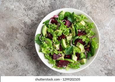 Healthy Vegan Avocado And Beet Salad In White  Bowl, Top View