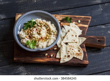 Healthy Vegan Cauliflower Hummus And Homemade Tortilla On A Dark Rustic Cutting Board On A Dark Background. Delicious Healthy Snack