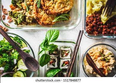 Healthy Vegan Food In Glass Containers. Flat Lay Of Stew With Chickpeas, Vegan Bergrer, Hummus, Kale Salad, Vegan Sushi Rolls And Bread.