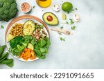 healthy vegan lunch bowl with Avocado, mushrooms, broccoli, spinach, chickpeas, pumpkin on a light background. vegetables salad. Top view.