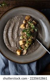 Healthy Vegan Mushroom Soup With Crackers, Made From Button Mushrooms And Coconut Cream, Dark Rustic Background