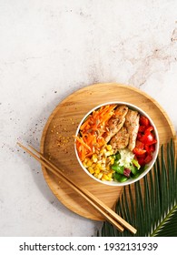 Healthy Vegan Poke Bowl Raw Salad, Heura Vegetable Protein, Vegan Chicken With Variety Vegetables, Served In Bowl On Tropical Leaves. Copy Space. Top View. Healthy Lunch, Vegetarian Restaurant Menu.