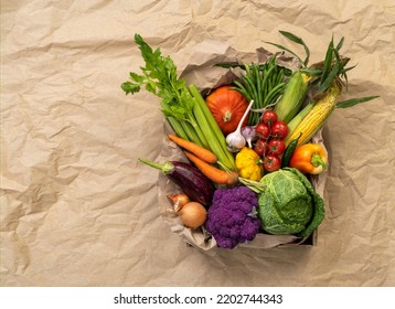 Healthy vegetables in basket. Photo of different vegetables on craft paper background, top view. High resolution product. - Powered by Shutterstock