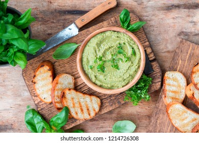 Healthy vegetarian dish basil green hummus, snack or appetizer