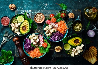 Healthy vegetarian eating, super food. The concept of healthy eating. On a black stone background. Top view.