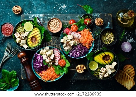 Healthy vegetarian eating, super food. The concept of healthy eating. On a black stone background. Top view.