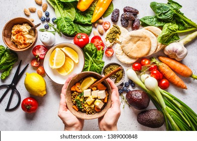 Healthy Vegetarian Food Background. Vegetables, Hummus, Pesto And Lentil Curry With Tofu.